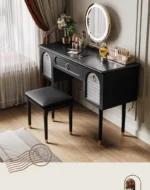 Goldoma compact vanity desk with drawer storage and mirror in a corner bedroom setting