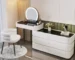 modern dressing table with mirror and stool in a bright bedroom