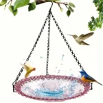 Bird bath water bowl hanging from a metal stand, with a blue ceramic basin and chain.