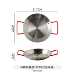 Stainless steel paella pan with double ears on a stove