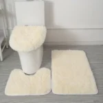 Plush bathroom rug set with toilet lid cover and mat in a modern bathroom
