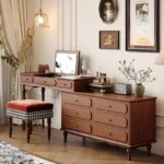 Minimalist oak wood dressing table with mirror, stool, and six drawers in a modern bedroom setting