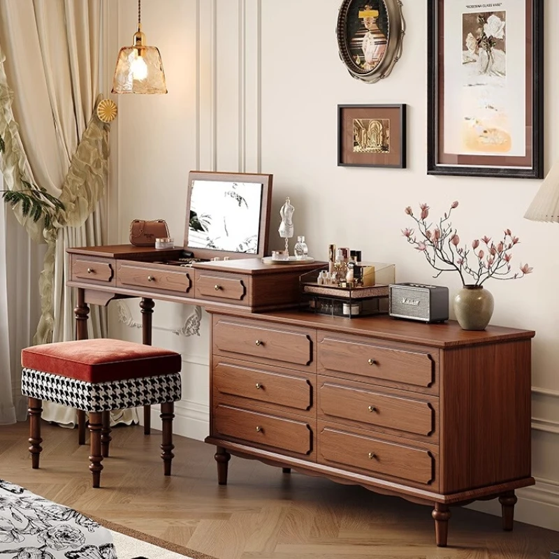 S54a689e4d9bc4238bc05b62b8b9d2f5eb.webp Minimalist oak wood dressing table with mirror, stool, and six drawers in a modern bedroom setting