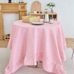 French country tablecloth with retro plaid pattern and lotus leaf edge on a dining table
