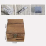 Old fashioned glass set with whiskey tumblers, ice stones, and wooden gift box on a rustic table