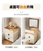 Modern lifting vanity table with mirror in cream finish, featuring rotating top and adjustable height for bedroom use
