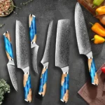 XITUO Japanese kitchen knife set with Damascus steel blades and blue resin handles on a cutting board