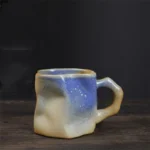 Japanese simple stoneware coffee cup on wooden table