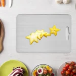 Double thick titanium cutting board with juice groove on a kitchen countertop