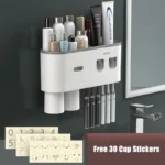 Complete bathroom storage rack set: toothpaste dispenser, toothbrush holder, and two cups on a shelf.
