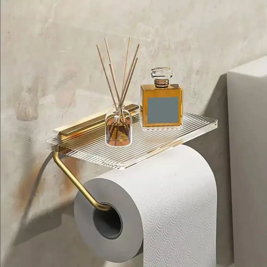 Aluminum alloy toilet paper holder with acrylic tray mounted on a white bathroom wall, side angle view.