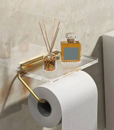 Aluminum alloy toilet paper holder with acrylic tray mounted on a white bathroom wall, side angle view.