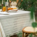 Retro polka dot tablecloth with fringe on a wooden table