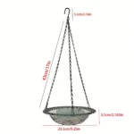 Outdoor bird bath with a blue ceramic bowl and metal chain, hanging on a patio pergola.