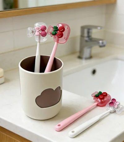 Cherry Design Toothbrush Holder in white ceramic with cute cherry pattern, front view.