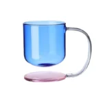 Colorful borosilicate glass drinking glasses on a wooden table
