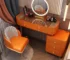Modern dressing table set with mirror and stool in a stylish bedroom