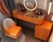 Modern dressing table set with mirror and stool in a stylish bedroom