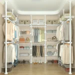 Freestanding coat rack with hooks holding jackets and bags in an entryway, adjustable design with sturdy steel frame