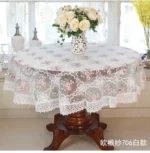 Elegant lace tablecloth with rose gold embroidery on a dining table