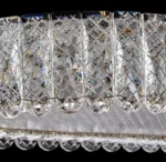 Luxury crystal chandelier illuminating a modern living room with sparkling light