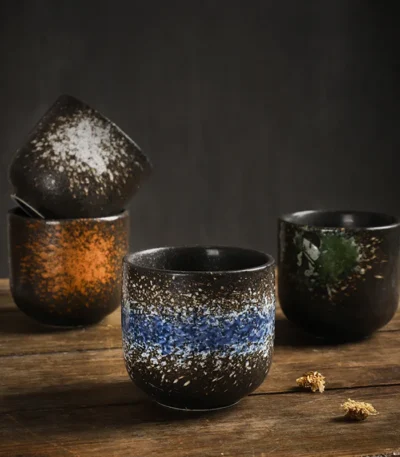 Japanese ceramic beer mug filled with amber ale, showcasing traditional glaze and ergonomic handle