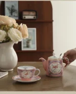 Elegant porcelain cups and saucers set on a wooden table