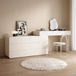 White minimalist wood dresser with mirror and stool in modern bedroom setting