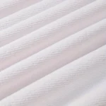 Ocean sunset pattern quick dry beach blanket on sandy beach with waves in background