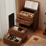 Wooden makeup vanity with mirror and stool in a modern bedroom setting