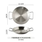 Stainless steel paella pan with double ears on a stove