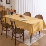 French country tablecloth with retro plaid pattern and lotus leaf edge on a dining table