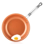 Goldoma nonstick frying pan with ceramic titanium coating on a stove