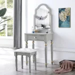 Modern white dressing table with mirror and stool in a bedroom setting