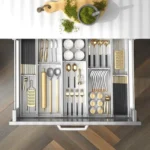 Kitchen drawer organizer with compartments for cutlery and utensils