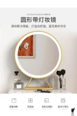 Marble top dressing table with lighted mirror and stool in a bedroom setting