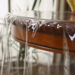 Elegant waterproof table cover with retro fringed lace on a dining table