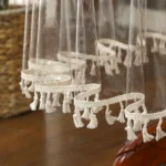 Elegant waterproof table cover with retro fringed lace on a dining table