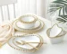 White ceramic salad bowl with heart-shaped design on a wooden table