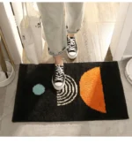 Modern abstract art non slip bathroom rug with vibrant colors and textured surface on a bathroom floor