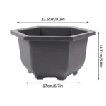 Rectangular planter with drainage tray, placed on balcony railing.