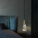 Modern crystal pendant lamp illuminating a dining room with elegant light refraction