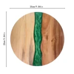 Round acacia cutting board with resin inlay on kitchen counter