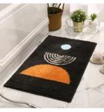 Modern abstract art non slip bathroom rug with vibrant colors and textured surface on a bathroom floor