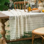 Retro polka dot tablecloth with fringe on a wooden table