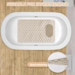 Oblong non-slip bath mat with suction cups on shower floor