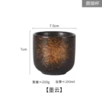Japanese ceramic beer mug filled with amber ale, showcasing traditional glaze and ergonomic handle