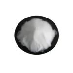 Close-up of fine white powder texture in a jar, soft focus background.