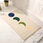 Modern abstract art non slip bathroom rug with vibrant colors and textured surface on a bathroom floor