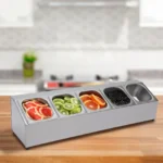 Stainless steel spice rack with 5 pans and lids on kitchen countertop